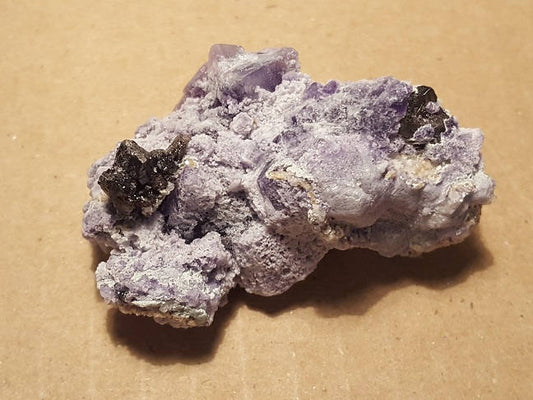 Cassiterite on fluorite specimen